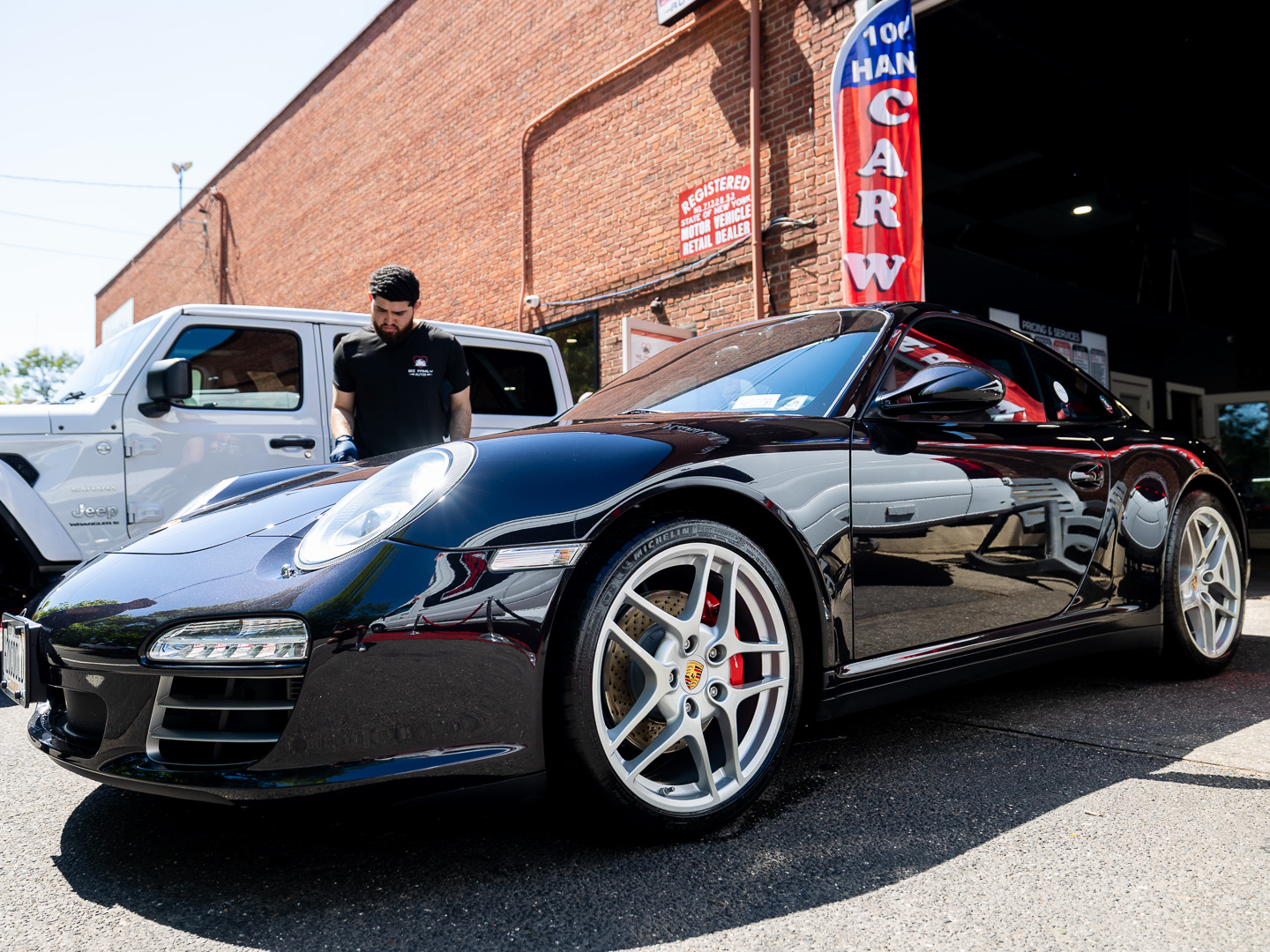 A Porsche finished by hand outside Biz Family Autos in Garden City, New York